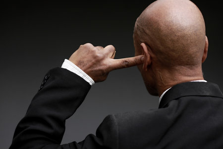 deafness suffering from hearing loss on grey black background with people stock image stock photoの写真素材