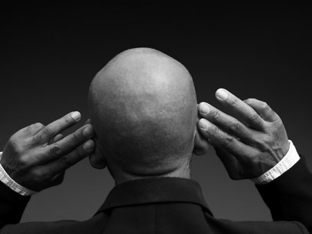 deafness suffering from hearing loss on grey black background with people stock image stock photoの写真素材