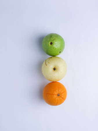 Colorful fruits on white background. Orange, lime and lemon.の写真素材