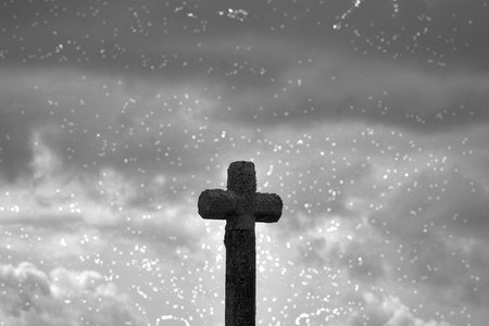 stone cross and clouds.の写真素材