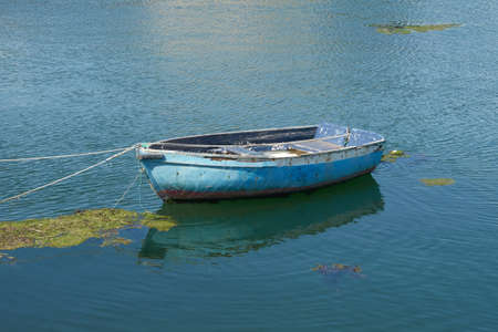 Boat and its reflection on the water.の写真素材