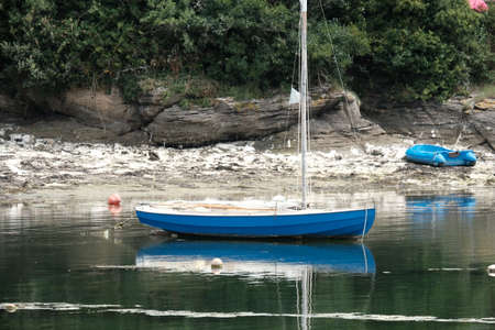 Sailboat at low tide.の写真素材