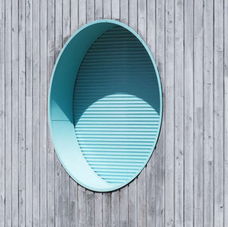 Round window and sliding shutter.の写真素材