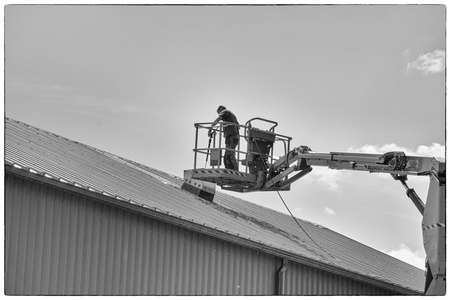 Man working on a boom lift.の写真素材