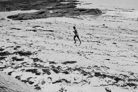 Sportsman running on the beach.の写真素材