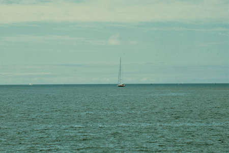 Sailboat on the horizon.の写真素材