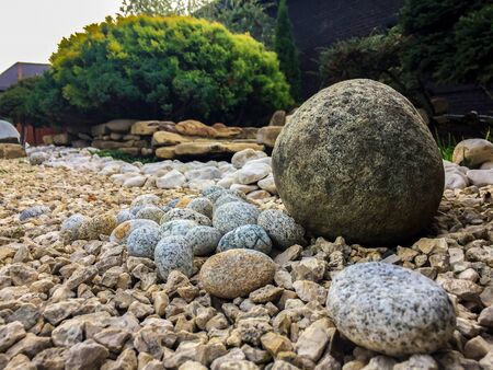 Stones of different types against the background of bushesの写真素材