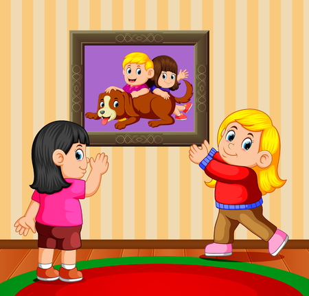the two girls holding the photo frame and looking their pictureのイラスト素材
