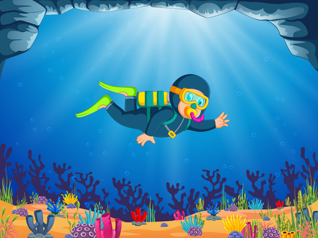 a boy is diving under the beautiful sea with the blue cloth divingの写真素材