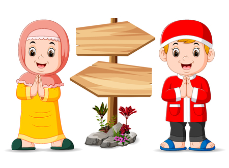 the two muslim children are standing near the wooden signpost