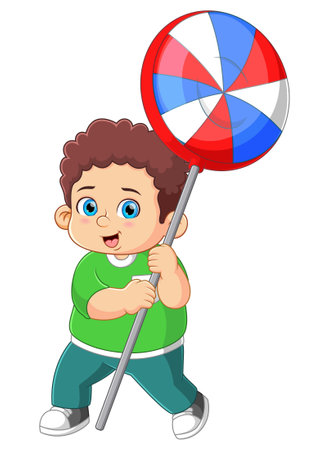 A cute boy holding a big lollipop candy of illustrationのイラスト素材