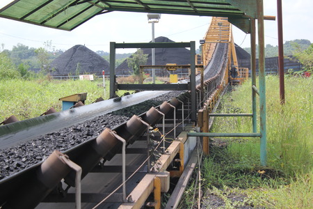 Process loading black coal mining from crusher to jetty conveyorの写真素材