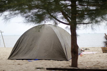 Camping the beach using a tentの写真素材