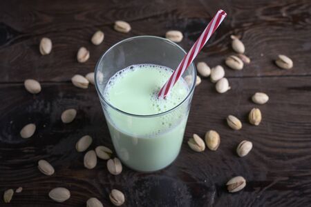Milk made with pistachios. Gourmet, vegan.Wood backgroundの写真素材