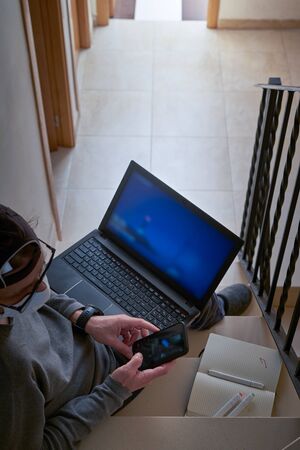 Man Working Indoors At Home Office, Corona Virus And Quarantine Concept.Stay at homeの写真素材