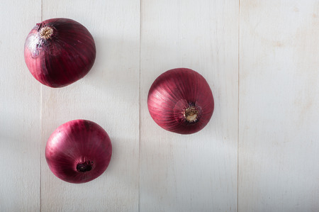 Close up of red onions on white backgroundの写真素材