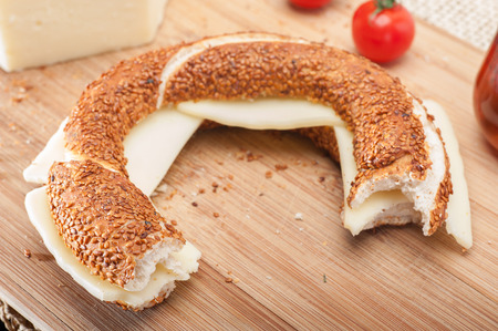 close up of a traditional Turkish bagel (simit) sandwich with cheese