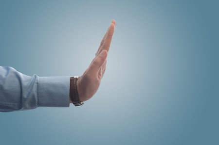 Businessman making stop sign  with his hand with copy  spaceの写真素材