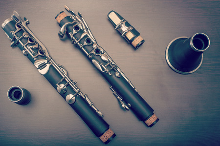 A clarinet dismantled, showings its parts on the tableの写真素材