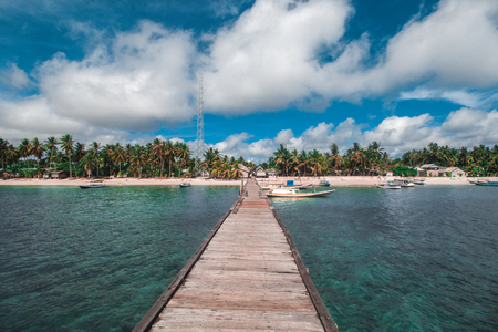 Traditional Wooden Dock and Beautiful Tropical Beachの写真素材