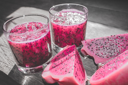 Red Dragon Fruit Juice in Cocktail Glass with Bokeh or Blur Effect Backgroundの写真素材