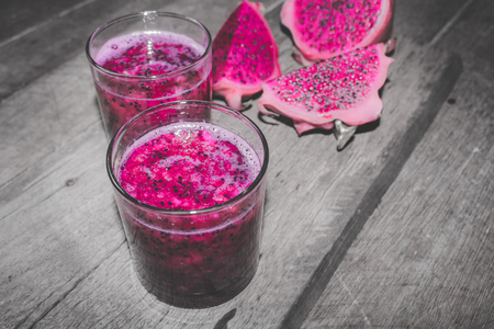 Red Dragon Fruit Juice in Cocktail Glass with Bokeh or Blur Effect Backgroundの写真素材