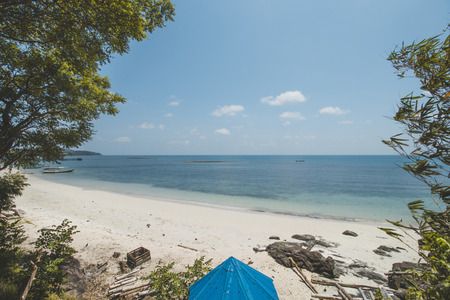 Clear Sea Water, White Sand, Cloudy Blue Sky and Tropical Beachの写真素材