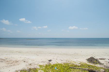 Clear Sea Water, White Sand, Cloudy Blue Sky and Tropical Beachの写真素材