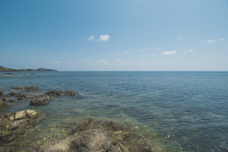 Clear Sea Water, Granite Rock, Cloudy Blue Sky and Tropical Beachの写真素材
