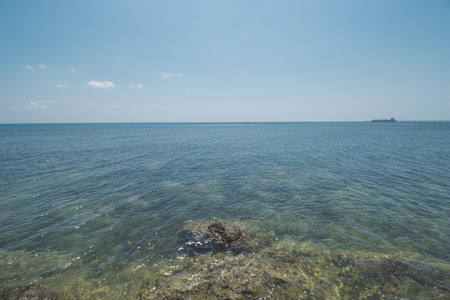Clear Sea Water, Granite Rock, Cloudy Blue Sky and Tropical Beachの写真素材