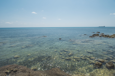 Clear Sea Water, Granite Rock, Cloudy Blue Sky and Tropical Beachの写真素材