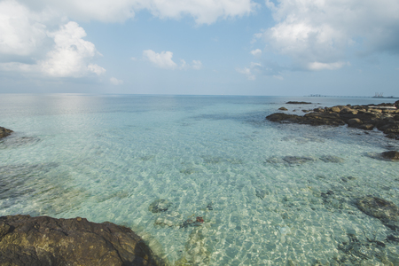 Cloudy Blue Sky, Granite Rock, Clear Sea Water and Tropical Beachの写真素材