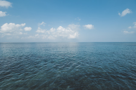 Clear Sea Water, Cloudy Sky and Tropical Beachの写真素材