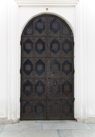 Ornamented rusty ancient door. Old decoration of the door to Cathedral of the Dormition in Kiev Pechersk Lavra - famous monastery inscribed on UNESCO world heritage list. Ukrainian landmark.のeditorial素材