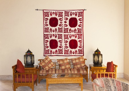 Vintage turkish arabian or indian lantern interior. Pillow on sofa decoration interior with morocco style photoの写真素材