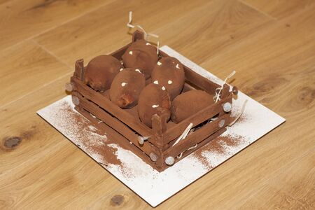 chokolate mini cake balls potatoes photo in box with tackの写真素材