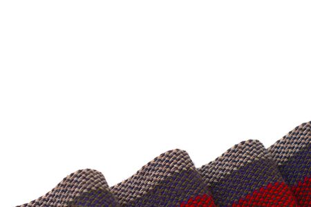 Red, gray and white striped scarf on white background. Plenty of negative space.