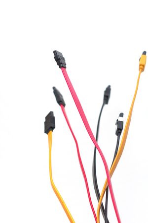 Red, black and yellow data cables on white background. Data storage, network server infrastructure...
