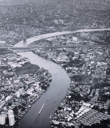 Aerial view of Bangkok, Thailand. and river Chao Phraya winding across the city. Black and white...