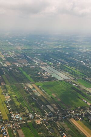 Crop fields and agricultural plantations on a rural area. Aerial view.の写真素材