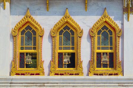 Temple of Wat Benchamabophit, located in Bangkok, Thailand. Architectural detail of the ornate golden windows.の写真素材