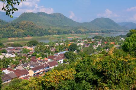 Elevated view of the town of Luang Prabang, Laos, from Mt. Phou Si, with the Mekong River on the background.の写真素材