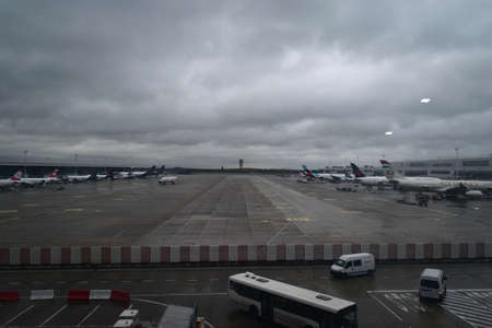 Brussels, Belgium - 2019-11-27: Airliners parked at the terminal in Brussels Airport, on a dark,...