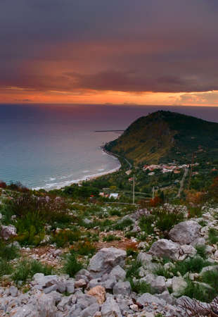 Elevated view of the coast near Terracina, Italy, at sunset.