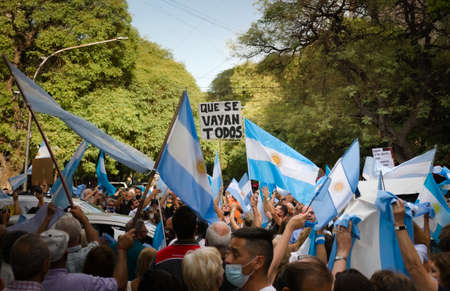 2021-02-27, Mendoza, Argentina - A sign reading "Out with them all" during a protest against the national government.のeditorial素材