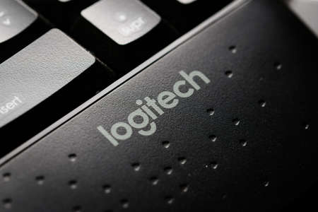 Logitech company brand logo in a modern black keyboard. Macro close up detail.のeditorial素材