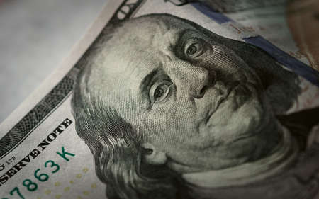 One hundred dollar bill, showing the face of Benjamin Franklin. Extreme macro close up.の写真素材