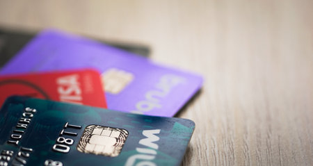Credit cards on a wooden table. Selective focus, close up, concept.