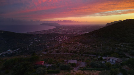 View of the sea from the hills surrounding Terracina, Italy, at dusk.の写真素材