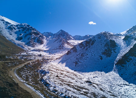 Snow covered Andes mountains near Vallecitos, in Mendoza, Argentina, on a clear sunny day.の写真素材